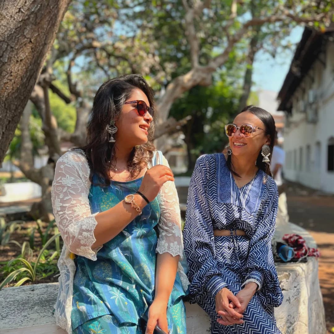 Two BHX participants talking in a courtyard